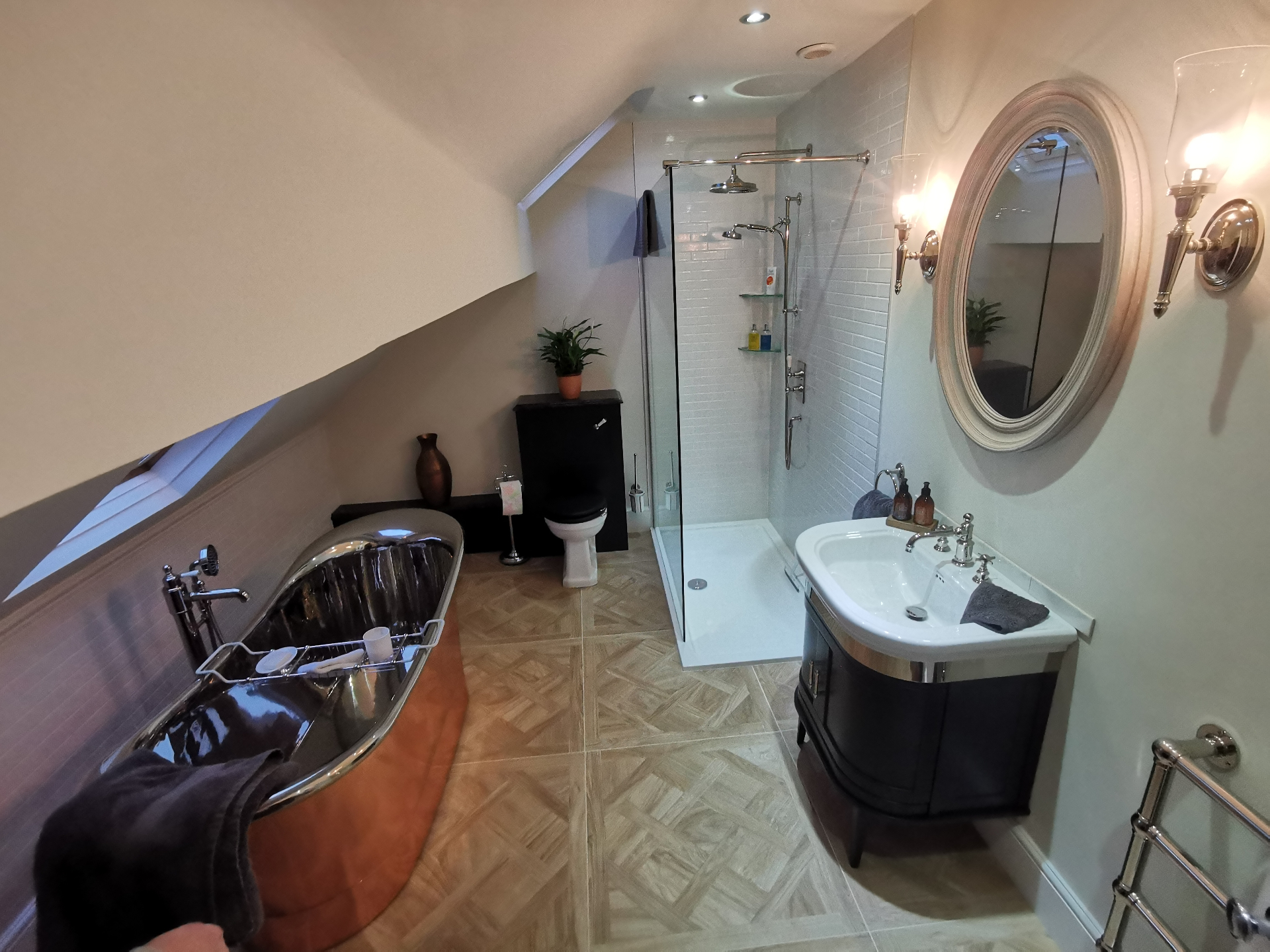 Full loft bathroom with copper bath and walk-in shower
