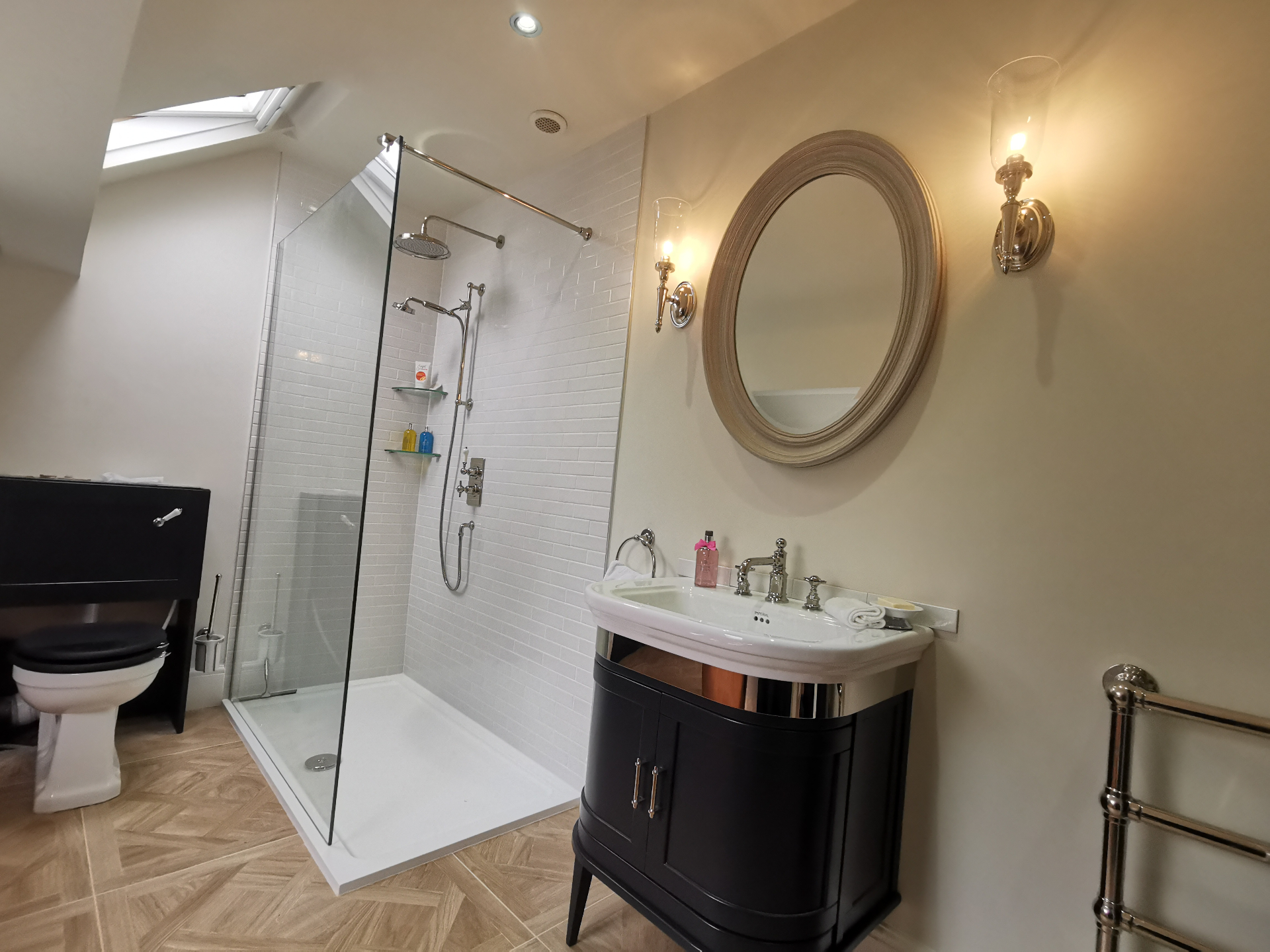 Loft shower room with skylight and walk-in shower
