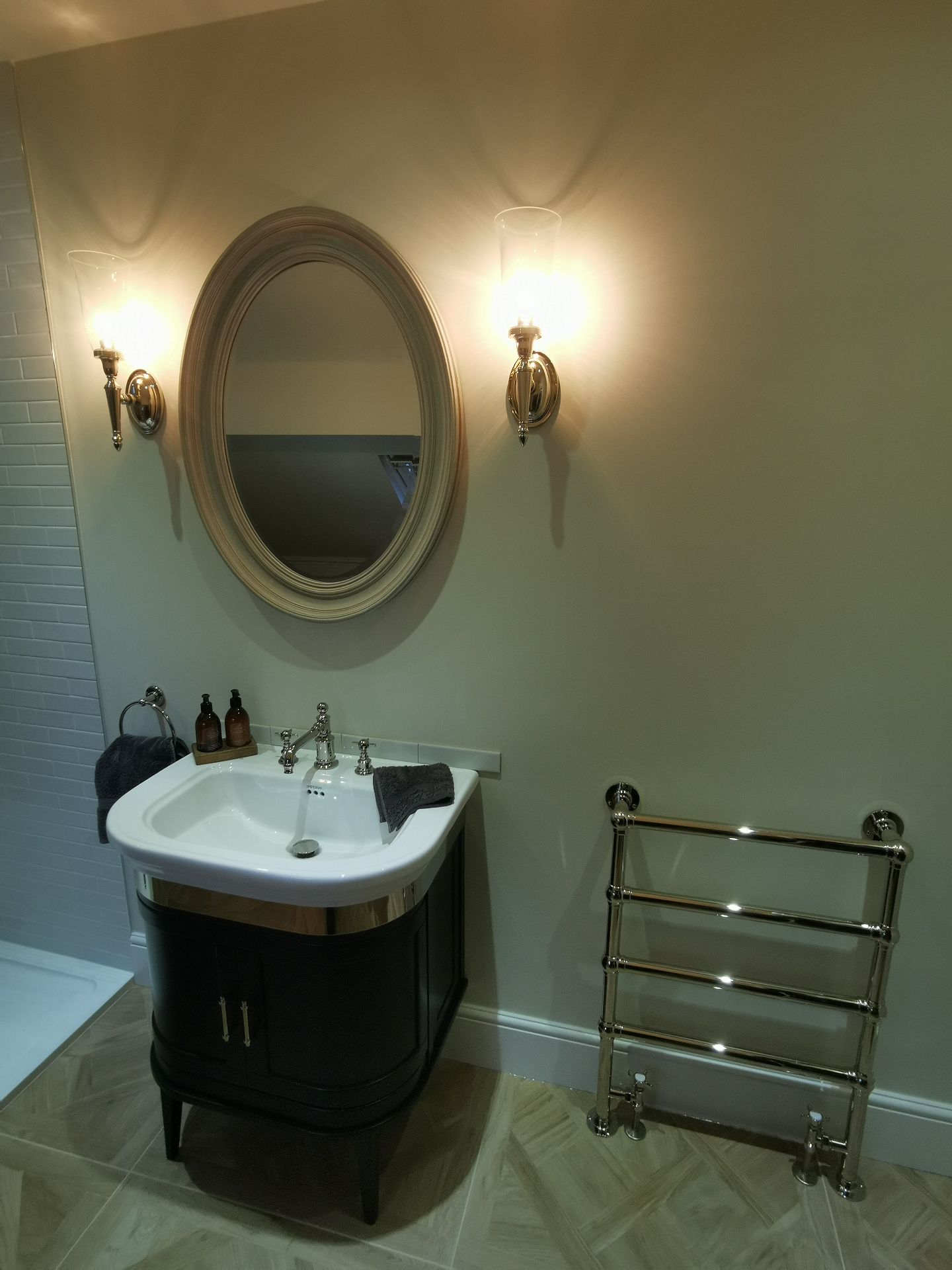 Classic vanity unit with framed mirror and chrome towel rail