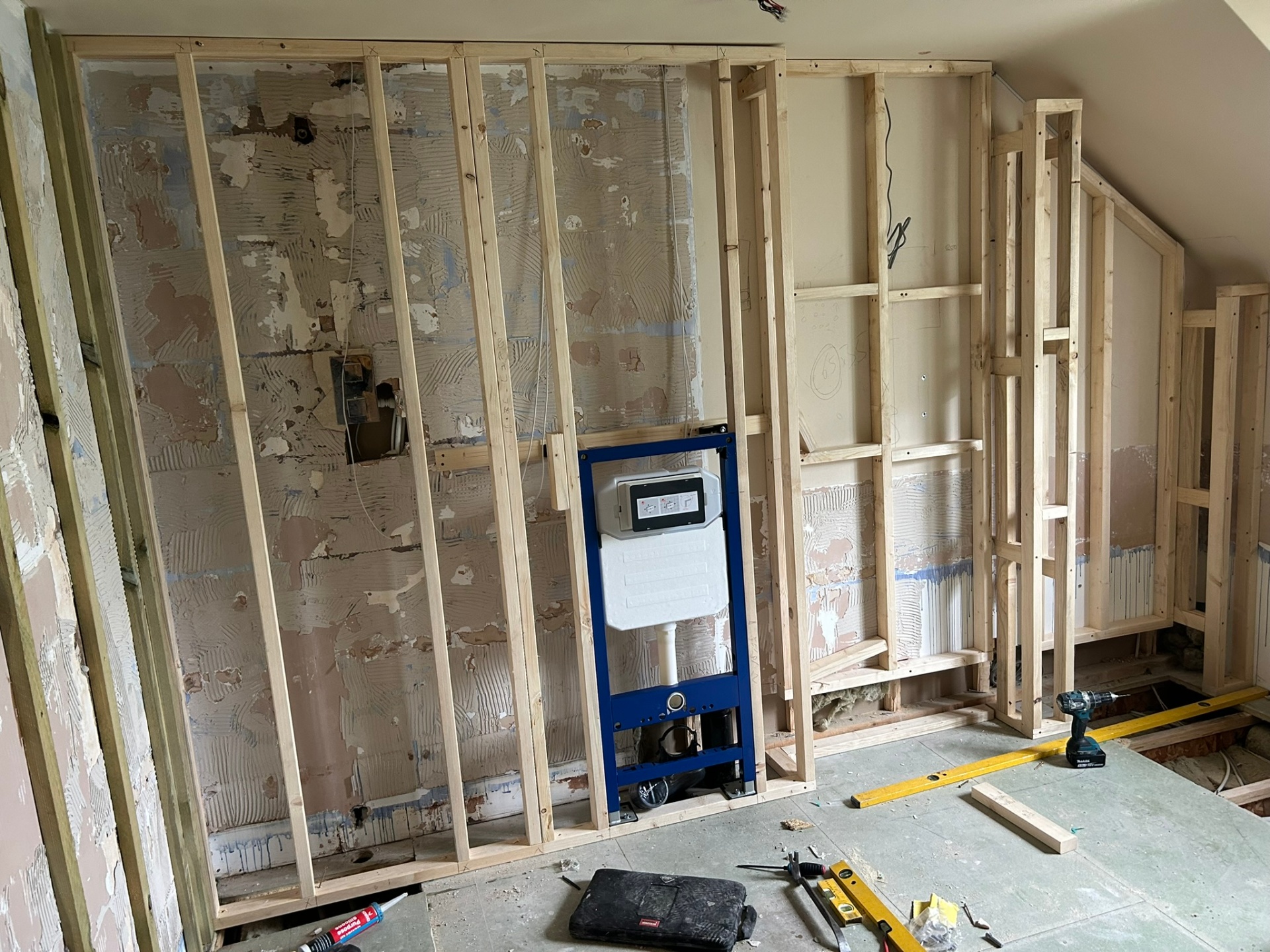 Loft bathroom mid-build – stud walls and concealed cistern