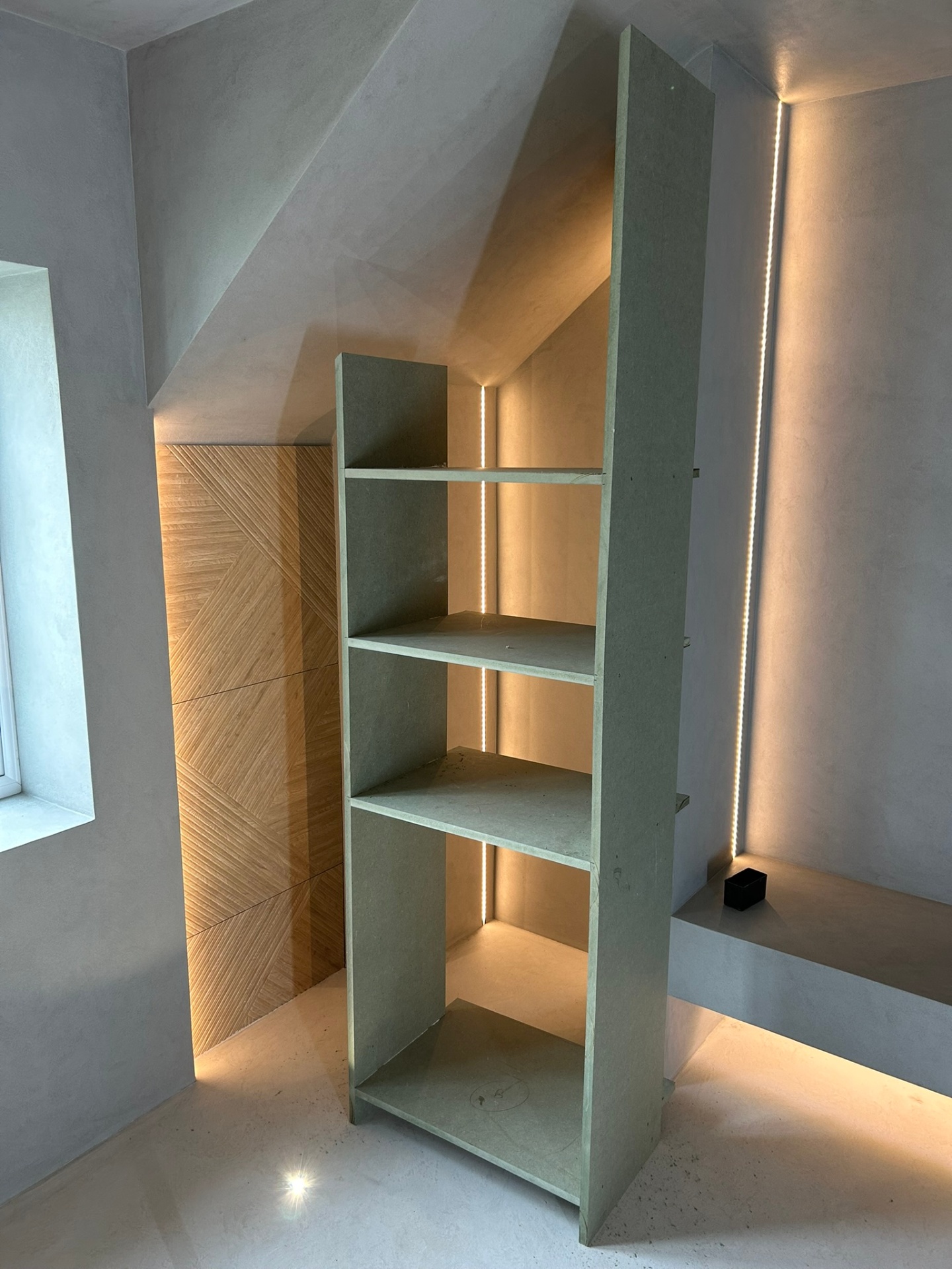 Custom built-in shelving with LED strip lighting